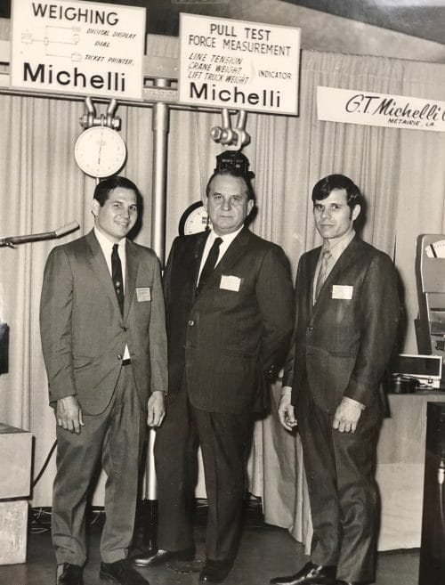 Michelli History - Photo of Ron Michelli, G.T. Michelli, and G.T. Michelli Jr. at the International workboat trade show