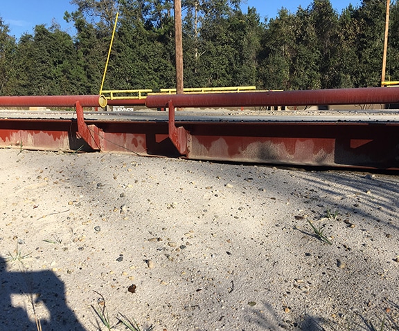 Debris on truck scale causes it to weigh light