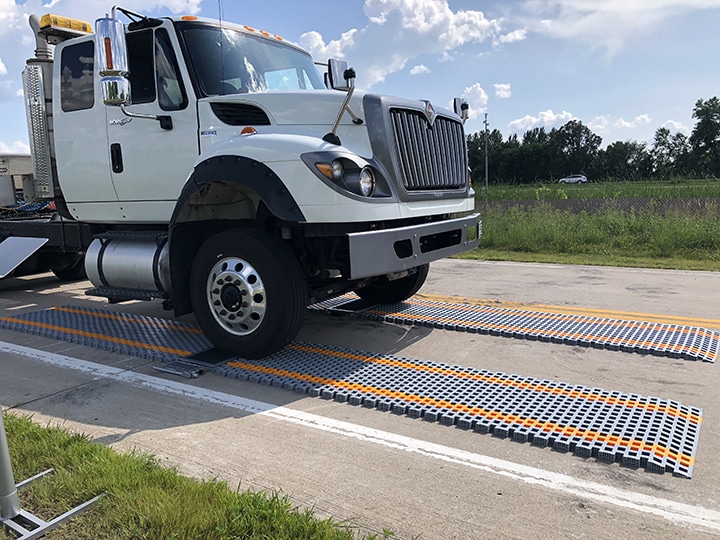 A truck demonstrates weigh-in-motion application on an Intercomp LS630 Portable Scale