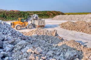 Truck being loaded with gravel in a gravel pit