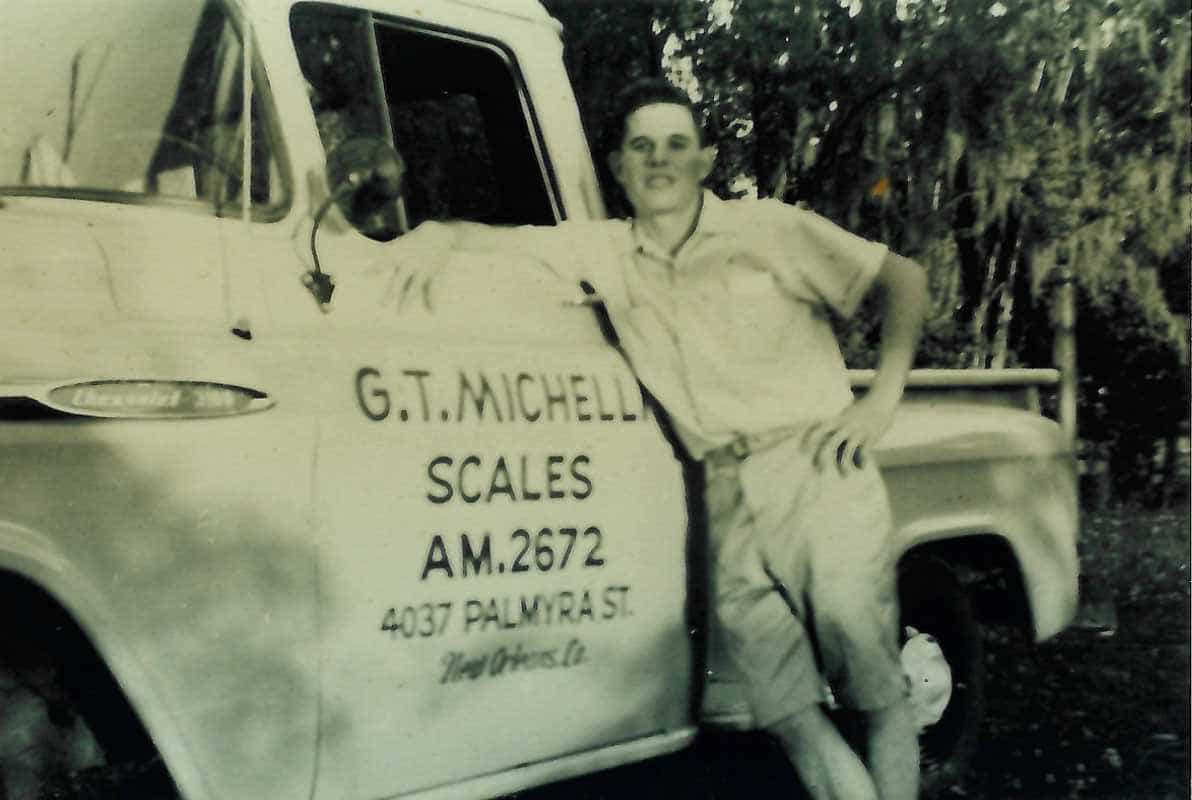 G.T. Michelli Jr. poses with his father's service truck