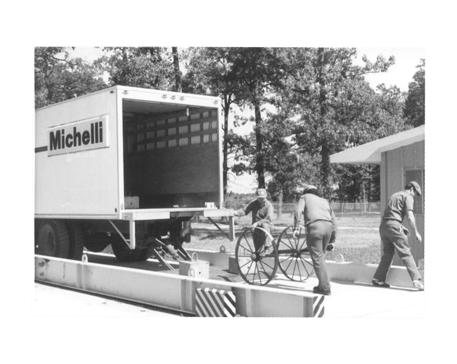 Michelli History - Michelli team members calibrate a truck scale using equipment they carried in a rented truck