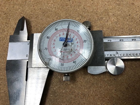 Caliper with busted dial