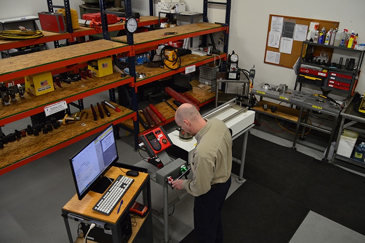 Calibration technician works at the torque calibration bench