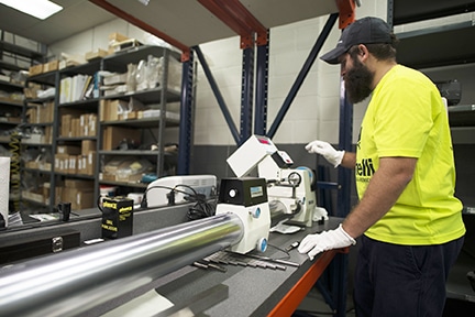 Michelli Weighing & Measurement metrologist working in the calibration lab