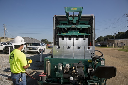 Michelli Weighing & Measurement heavy duty test truck interior Michelli Weighing & Measurement technician uses remote to pull test cart out of heavy duty test truck