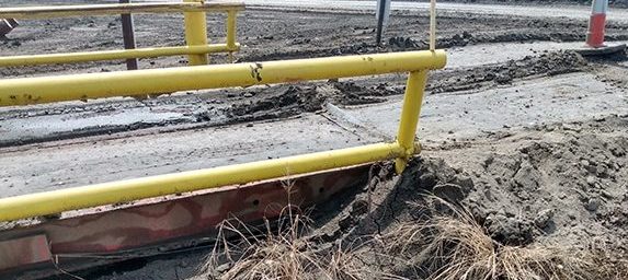 Mud on top of truck scale and build up underneath scale that can be prevented with regular equipment maintenance