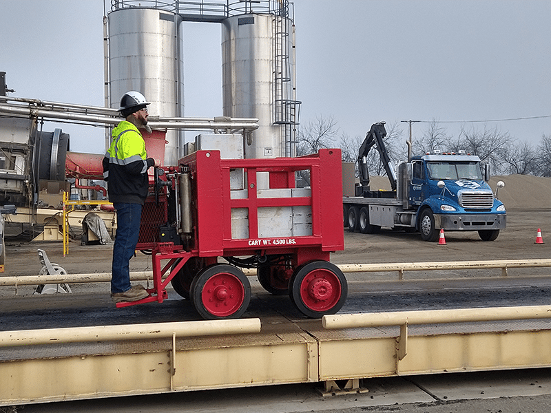 Michelli Weighing & Measurement technician uses heavy duty test cart to perform truck scale calibration