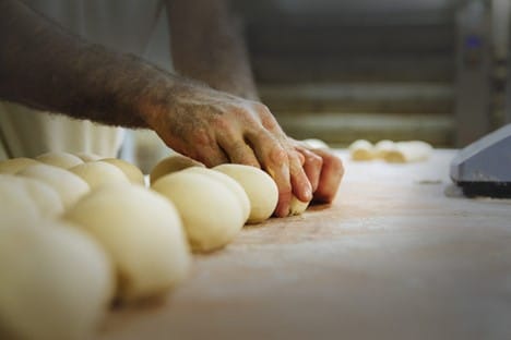 Baker rolling dough