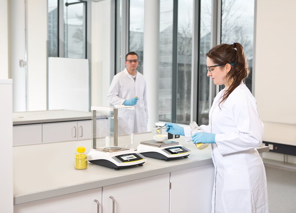 Lab workers use the Sartorius Entris II balance