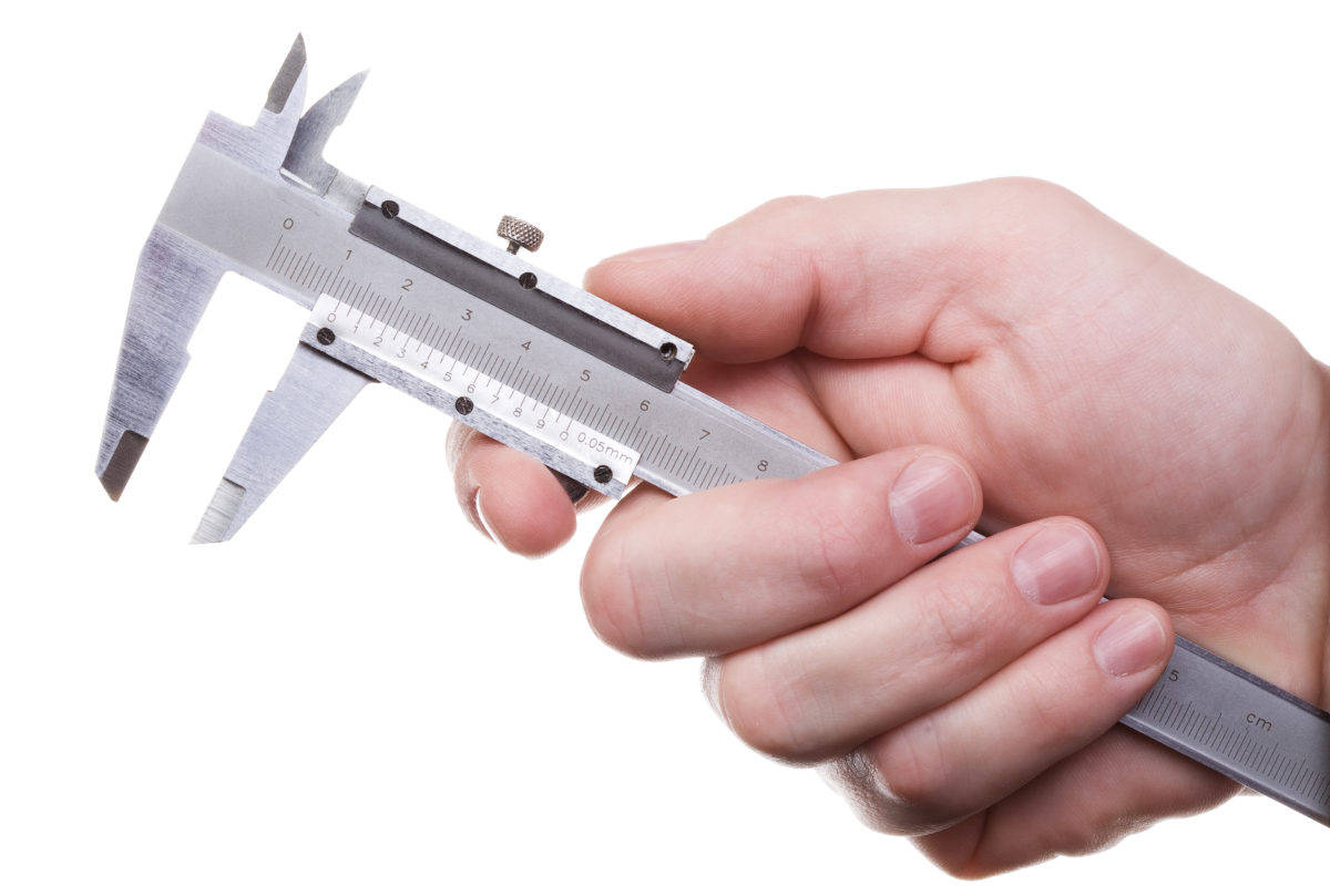 Hand holding vernier caliper