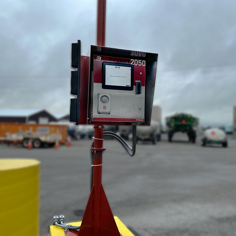 B-TEK Scales DD2050 indicator mounted on a red pole to enable truck scale automation